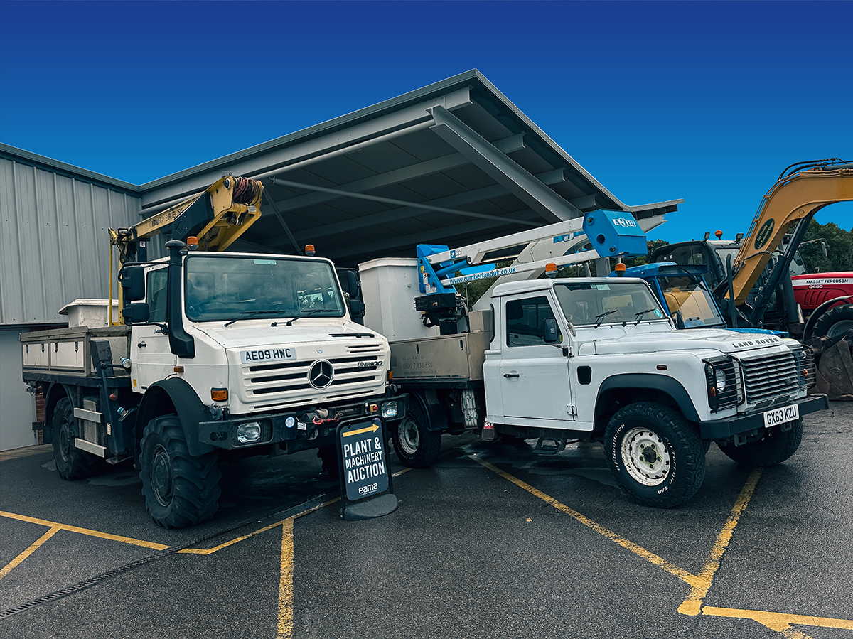 diggers in front of warehouse